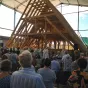 La charpente de Notre Dame dans les locaux des ateliers Perrault à Saint Laurent de la Plaine à l'occasion de sa bénédiction par Mgr Delmas, évêque d'Angers (septembre 2023)